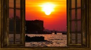 Venice at sunset through a window