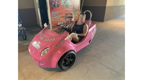 My aunt and I in the little Scoot Coup! What fun!
