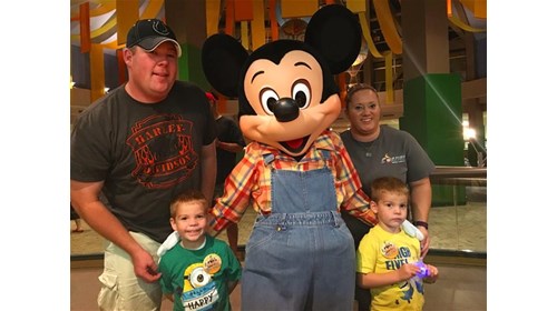 Mickey Mouse and my family together.