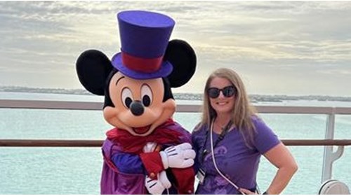Alison with Mickey during a cruise Oct 2022