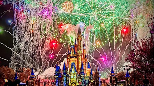 Fireworks going off behind Disney castle