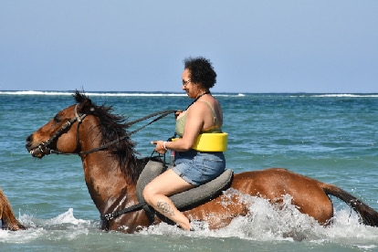 Jamica Horse back riding in the water.