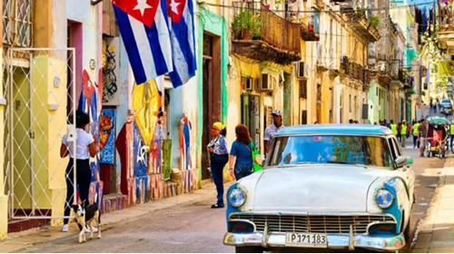 Colorful Cuban streets, locals, and vintage car