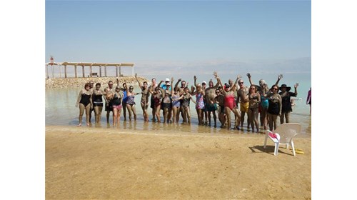 Holy Land Pilgrimage at Dead Sea - covered in mud!