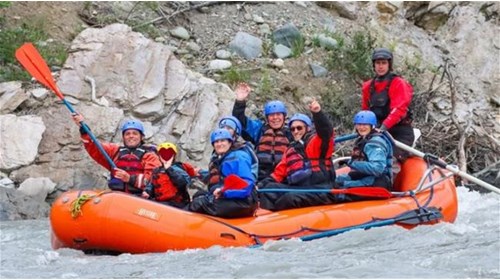 The family enjoys a rafting adventure in Denali