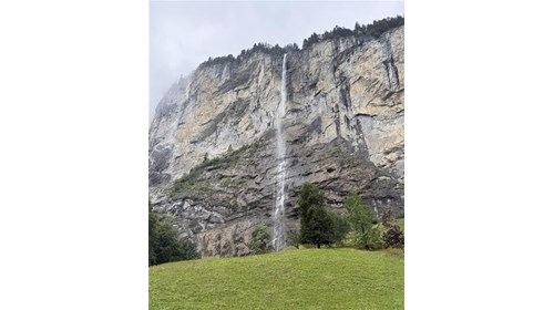 Misty cascade down Lauterbrunnen cliffs