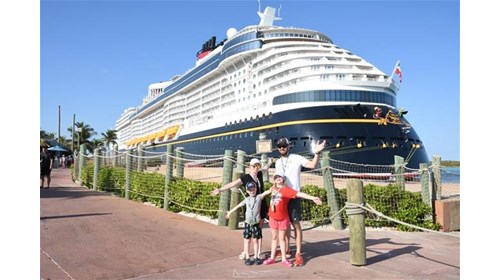 Our family in front of the Disney Treasure