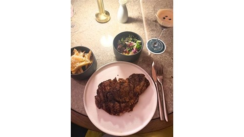 Truffle fries in a dedicated fryer with a ribeye