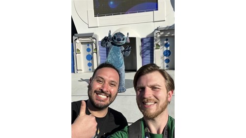 Me(on right) with my fiancé with Stitch at WDW