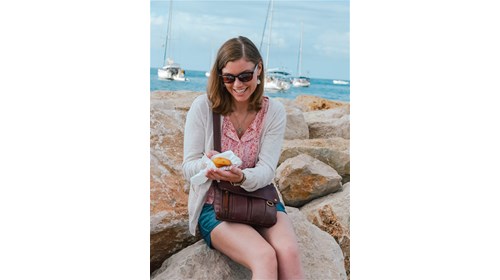 Enjoying a fresh madeleine in France.