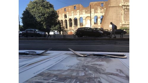 View of Colosseum in Rome from a cafe