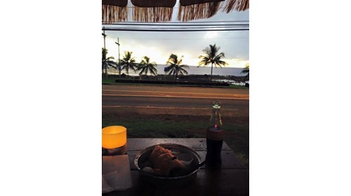 Eating dinner while watching sunset in Hawaii