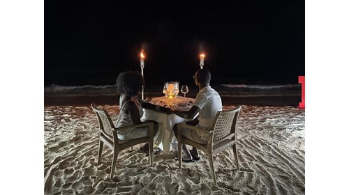 Enjoying candlight dinner for 2 on the beach