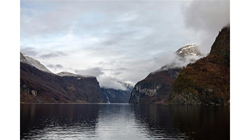 Where fjords whisper and time gently slows down.