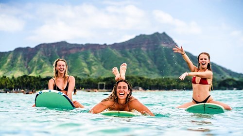 Surfing in front of Diamond Head Crater