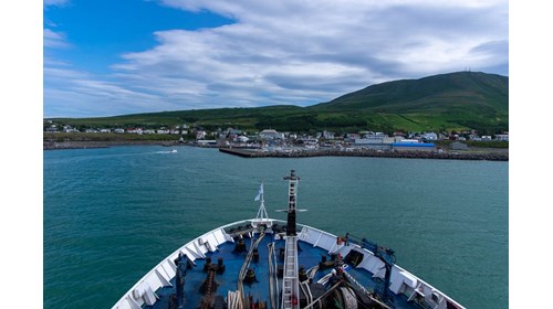A cruise pulling into Húsavík in Iceland