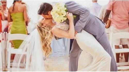 Beautiful bride and groom kissing after wedding