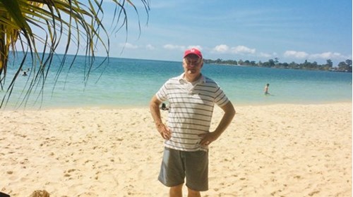 Richard Snelgrove on the beach in Cambodia