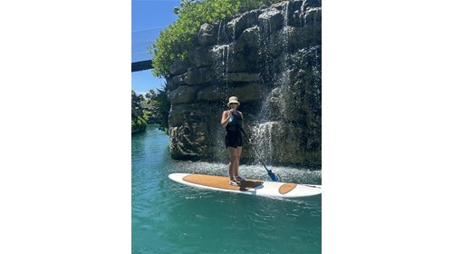 Sarah paddle boarding at Hotel Xcaret Arte