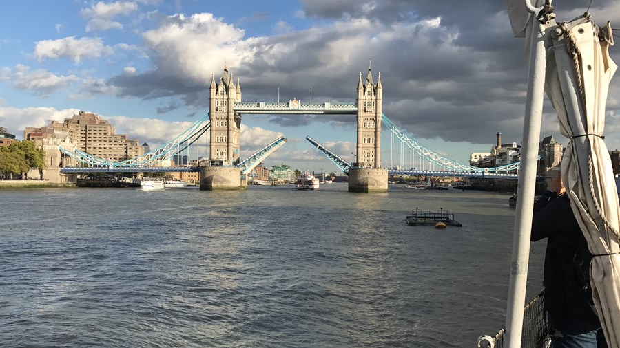 Watching boats travel under Tower Bridge
