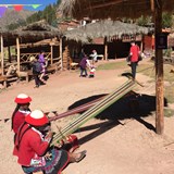 The locals hard at work spinning llama wool