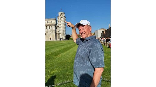 At the Leaning Tower of Pisa trying to straighten!